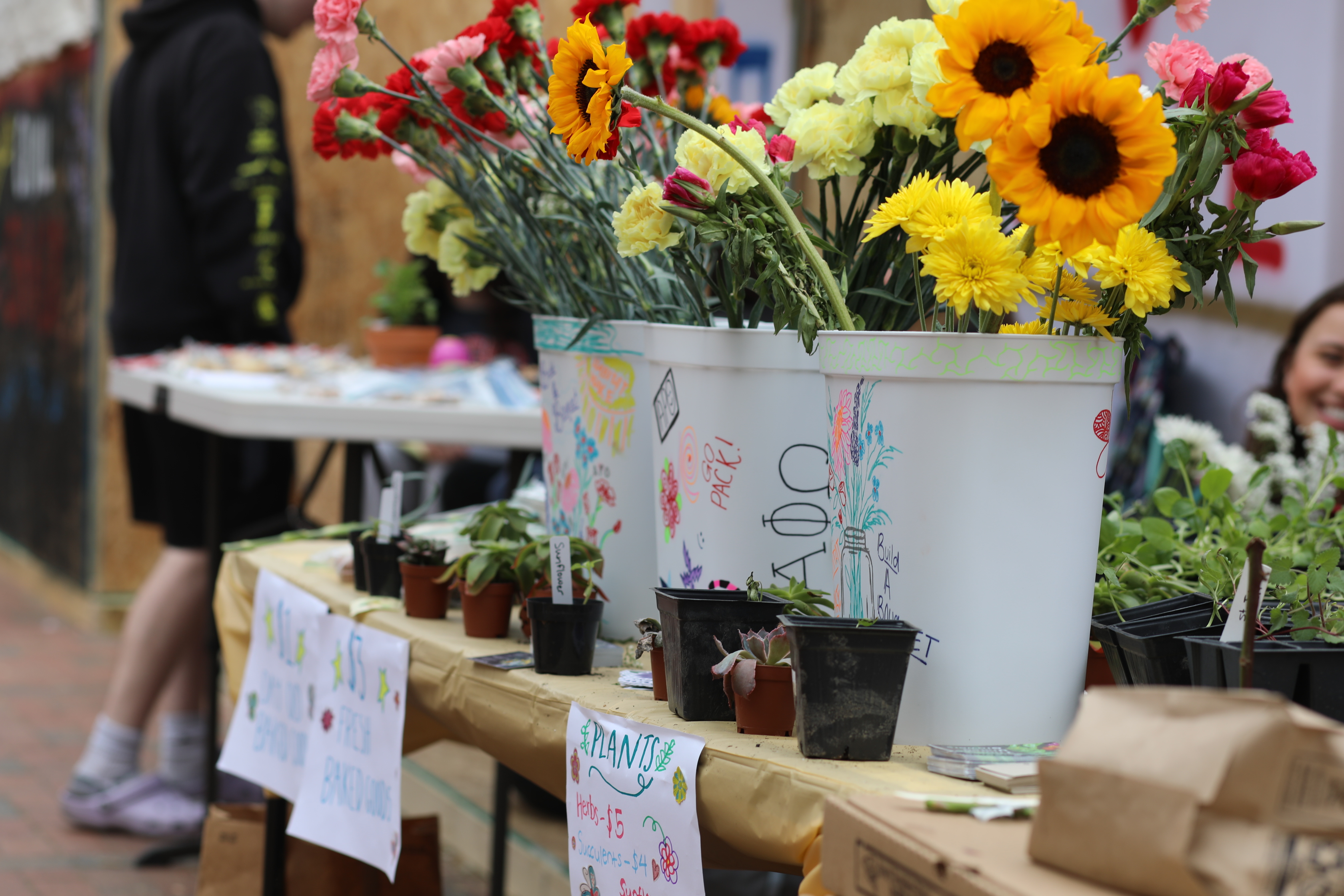 bucket of flower arrangements sold by students at Shack-A-Thon