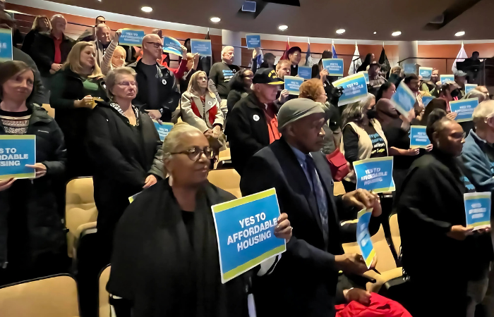 Advocacy Ambassadors stand up for affordable housing at a city council meeting