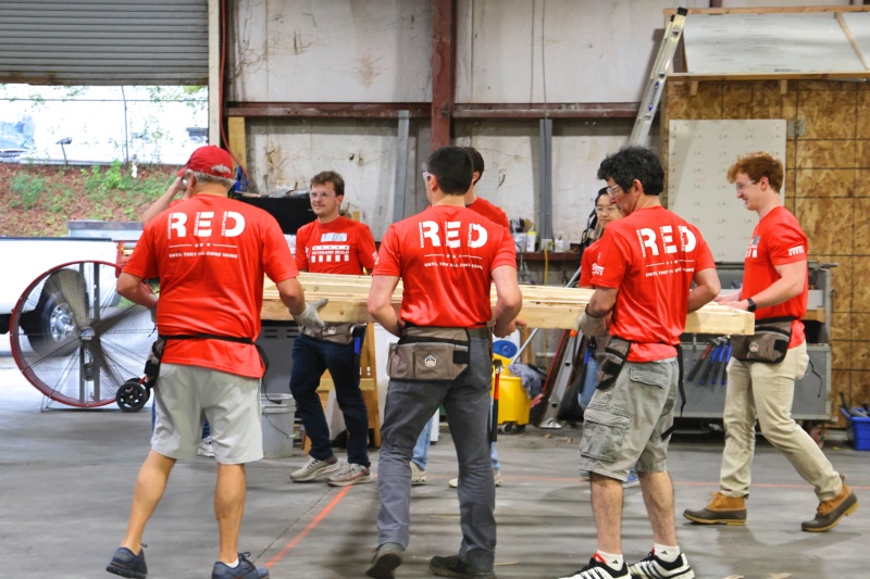 Volunteers participate in a wall build as part of Habitat Wakes' veteran's build series