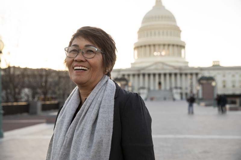 Woman smiling in front of US Capitol Building