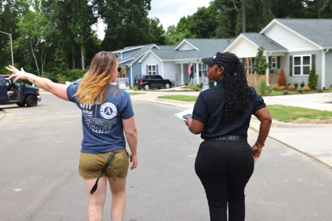 Homeowner and Habitat Wake staff tour homes