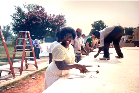 Dorothy Smith hammers the floors of her Habitat Wake home, 1987